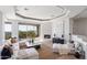 Spacious living room boasts stunning views and a cozy fireplace at 12943 E Corrine Dr, Scottsdale, AZ 85259