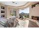 Peaceful main bedroom features a cozy sitting area and stunning views at 12943 E Corrine Dr, Scottsdale, AZ 85259