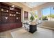 Bright home office with built-in shelving and desk at 12943 E Corrine Dr, Scottsdale, AZ 85259