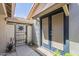 Charming front entry with a secure gate and double doors for added privacy at 34 N Agua Fria Ln, Casa Grande, AZ 85194