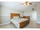 Comfortable main bedroom with neutral colors, a ceiling fan, and ample natural light at 34 N Agua Fria Ln, Casa Grande, AZ 85194
