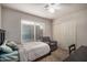 Bedroom with bed, sitting chair, and closet at 11035 E Clinton St, Scottsdale, AZ 85259
