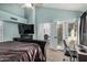 Serene main bedroom with high ceilings, a desk space, and patio doors to outside at 11035 E Clinton St, Scottsdale, AZ 85259