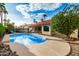 Backyard pool with patio, palm trees and blue sky at 11035 E Clinton St, Scottsdale, AZ 85259