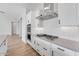 Gourmet kitchen featuring stainless steel appliances and a modern range hood at 21611 S 191St Pl, Queen Creek, AZ 85142