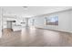 Open-concept living room featuring an eat-in kitchen and expansive tile flooring at 21611 S 191St Pl, Queen Creek, AZ 85142