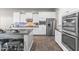 Modern kitchen featuring white cabinets, stainless steel appliances, and a functional island at 2229 N Beverly Pl, Buckeye, AZ 85396