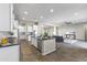 Open concept kitchen featuring center island with view to living space at 2229 N Beverly Pl, Buckeye, AZ 85396