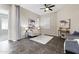 Cozy living room featuring stylish furniture, a ceiling fan, and neutral tones at 2229 N Beverly Pl, Buckeye, AZ 85396