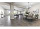 Open-concept living space seamlessly integrates the dining room, living room, and kitchen areas at 2229 N Beverly Pl, Buckeye, AZ 85396