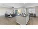Open layout showcasing the living room, dining area, and kitchen with a large island at 2229 N Beverly Pl, Buckeye, AZ 85396