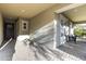 Covered patio with brick pavers, recessed lighting, and comfortable seating area at 2229 N Beverly Pl, Buckeye, AZ 85396