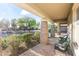 Charming front porch with brick columns and a relaxing seating area at 2229 N Beverly Pl, Buckeye, AZ 85396