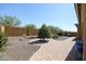 Landscaped backyard with a brick pathway and gravel at 14133 S 179Th Ave, Goodyear, AZ 85338