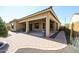 Backyard with covered patio and brick pathway at 14133 S 179Th Ave, Goodyear, AZ 85338