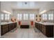 Bright Primary bathroom boasts double sinks and a large soaking tub at 14133 S 179Th Ave, Goodyear, AZ 85338