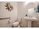 Powder room with pedestal sink and decorative wall art at 14133 S 179Th Ave, Goodyear, AZ 85338