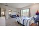 Bright bedroom with large windows, comfortable seating, and plenty of natural light at 14133 S 179Th Ave, Goodyear, AZ 85338