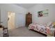 Bright bedroom with floral bedding and ample closet space at 14133 S 179Th Ave, Goodyear, AZ 85338