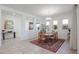 Dining area with wood table, chandelier, and rug at 14133 S 179Th Ave, Goodyear, AZ 85338