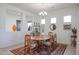 Dining area with wood table and chandelier at 14133 S 179Th Ave, Goodyear, AZ 85338