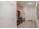 Inviting entryway with bench and built-in shelving at 14133 S 179Th Ave, Goodyear, AZ 85338