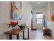 Bright entryway with wood console table and art at 14133 S 179Th Ave, Goodyear, AZ 85338