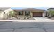 One-story home with tile roof, shutters, and attached garage at 14133 S 179Th Ave, Goodyear, AZ 85338