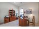 Home office with built-in shelves and a large desk at 14133 S 179Th Ave, Goodyear, AZ 85338