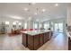 Open kitchen features a large island, perfect for casual dining and entertaining at 14133 S 179Th Ave, Goodyear, AZ 85338
