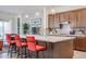 Modern kitchen with island, stainless steel appliances, and ample counter space at 14133 S 179Th Ave, Goodyear, AZ 85338