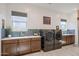 Laundry room with washer, dryer, and ample counter space at 14133 S 179Th Ave, Goodyear, AZ 85338