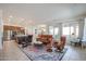 Open concept living room with views into the kitchen and dining area at 14133 S 179Th Ave, Goodyear, AZ 85338