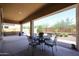 Covered patio with seating area and view of backyard at 14133 S 179Th Ave, Goodyear, AZ 85338