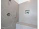 Modern shower with hexagon tile and built-in seat at 14133 S 179Th Ave, Goodyear, AZ 85338