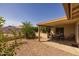Covered patio and gravel backyard featuring privacy wall at 1729 Leisure World --, Mesa, AZ 85206