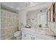 Neutral bathroom with patterned shower curtain, white vanity, and tiled floor at 1729 Leisure World --, Mesa, AZ 85206