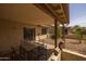 Covered patio with outdoor table and desert landscaping viewed from under the patio awning at 1729 Leisure World --, Mesa, AZ 85206