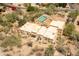 Aerial view of home featuring a backyard pool with lush foliage at 7002 N Hillside Dr, Paradise Valley, AZ 85253
