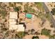 An aerial view of a tan home featuring a backyard pool at 7002 N Hillside Dr, Paradise Valley, AZ 85253