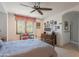 Bright bedroom with a view, featuring natural light and comfortable furniture creating a cozy and serene space at 7002 N Hillside Dr, Paradise Valley, AZ 85253