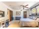 Spacious bedroom features neutral tones, a sitting area and a desk area for convenience at 7002 N Hillside Dr, Paradise Valley, AZ 85253