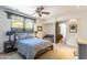 Comfortable bedroom with a full bed, sitting area and access to a bathroom through an archway at 7002 N Hillside Dr, Paradise Valley, AZ 85253