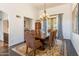 Elegant dining room with a large table, upholstered chairs, and a chandelier at 7002 N Hillside Dr, Paradise Valley, AZ 85253