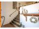 Charming entryway featuring wood stairs, a decorative shelf, and a welcoming, neutral color palette at 7002 N Hillside Dr, Paradise Valley, AZ 85253