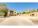 Beautiful home exterior with a charming driveway, mountain views, and attached garages, bathed in sunlight at 7002 N Hillside Dr, Paradise Valley, AZ 85253