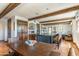 Open-concept kitchen showcasing a large island, wood beams, and custom cabinetry, perfect for entertaining at 7002 N Hillside Dr, Paradise Valley, AZ 85253