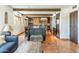 Stylish living room with exposed wood beams, an island, and an open floor plan, perfect for modern living at 7002 N Hillside Dr, Paradise Valley, AZ 85253