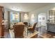 Charming living room with a fireplace, hardwood floors, and ample natural light at 7002 N Hillside Dr, Paradise Valley, AZ 85253