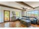 Cozy living room with natural light, comfortable seating, and access to an outdoor area at 7002 N Hillside Dr, Paradise Valley, AZ 85253